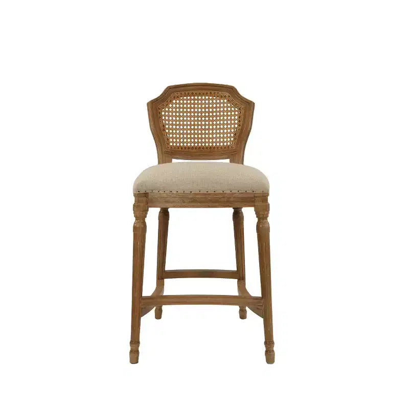 Taburete alto Wilbrandt de roble: tapizado de lino, ribete con clavos decorativos, patas talladas