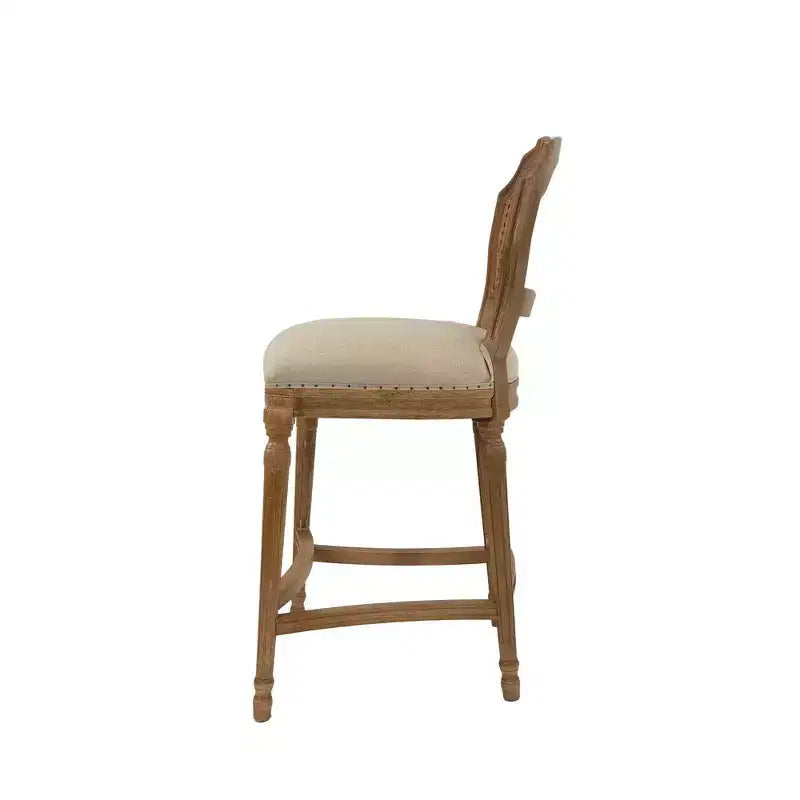 Taburete alto Wilbrandt de roble: tapizado de lino, ribete con clavos decorativos, patas talladas