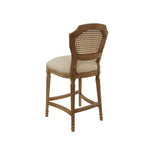 Taburete alto Wilbrandt de roble: tapizado de lino, ribete con clavos decorativos, patas talladas